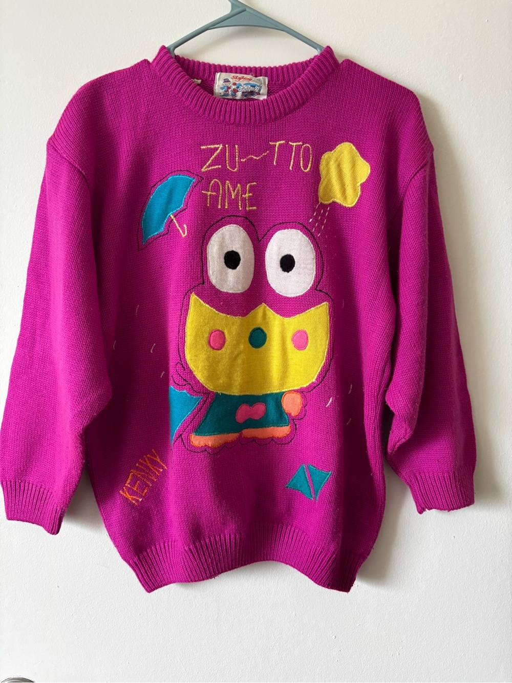 Folk Magenta Knit Sweater with Colorful Label Appliqué